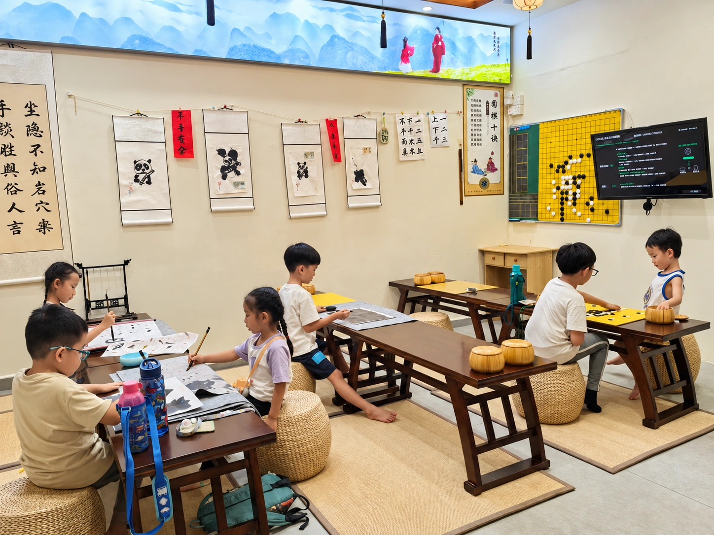 Student Care Children learning calligraphy and Weiqi at Hong Meng Academy in Hougang