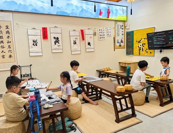 Children learning Weiqi and Chinese calligraphy at Hong Meng Academy in Hougang