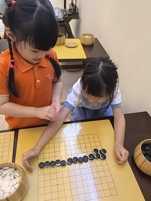 Children practising Weiqi at Hong Meng Academy Members' Day in Hougang