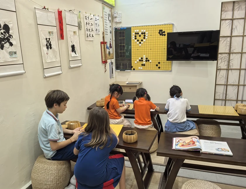 Children learning Weiqi at Hong Meng Academy in Hougang